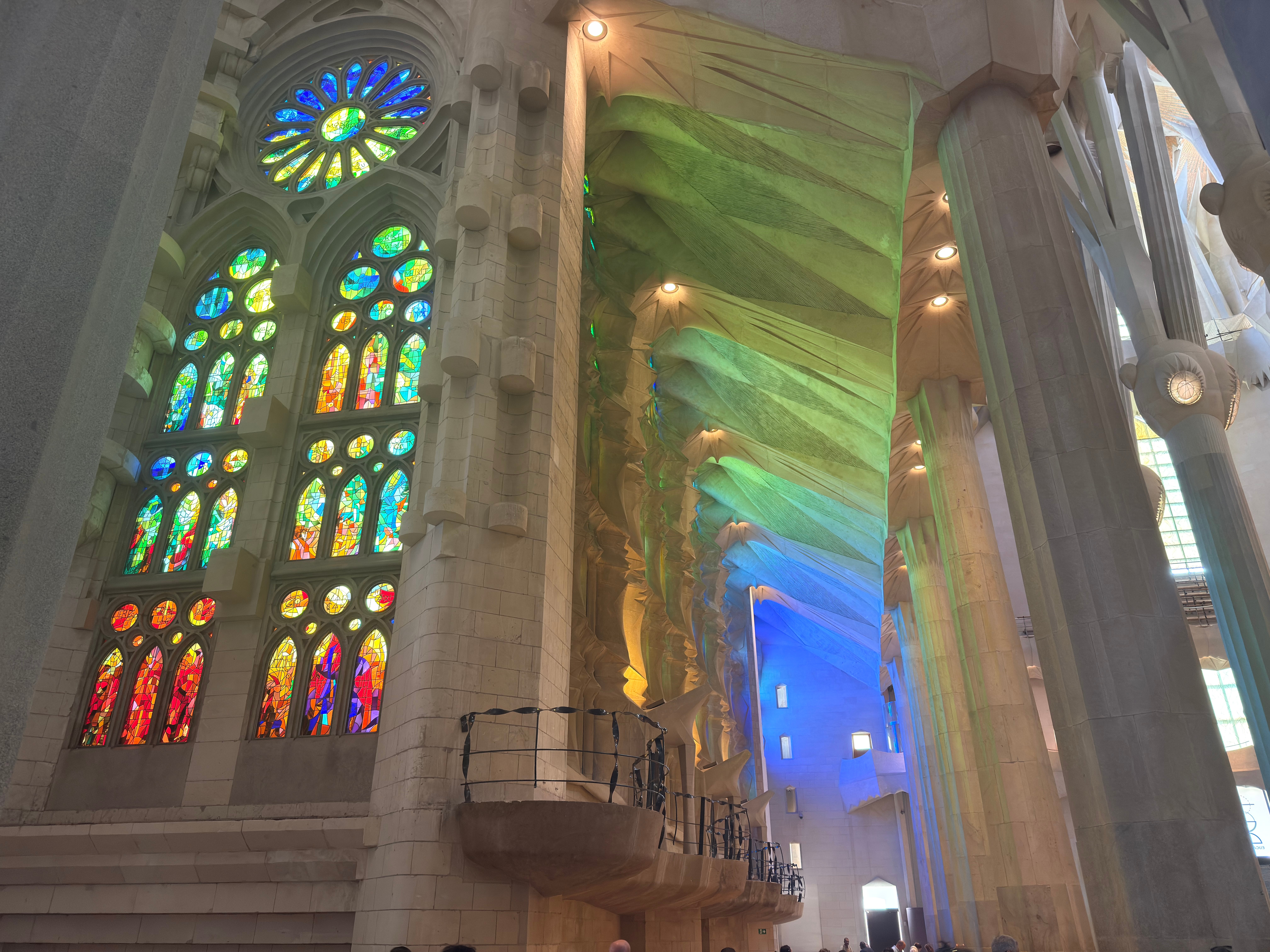 Stained glass and sculpted columns inside Gaudí's Sagrada Família, Barcelona.